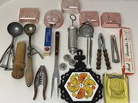 Full lot showing all utensils, molds, trivet, egg slicer