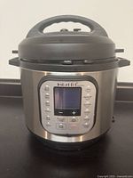 Front view of Instant Pot Duo Nova pressure cooker with lid attached