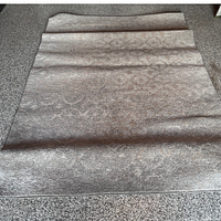 Full view of grey rug laid flat showing overall size and pattern