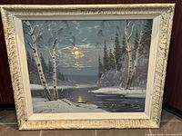 Full view of framed winter landscape painting