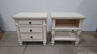 Pair of white washed wood nightstands, one with drawers and one with open shelf