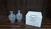 Pair of vintage Fenton hobnail perfume bottles displayed with a white box labeled Mikasa, presumably containing the crystal bowl.