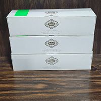 Three white boxes each labeled as Stangl Lead Crystal Flatware Caddy Knives, stacked with branding visible.