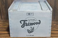 Front view of the wooden crate with sliding lid, showing L.L.Bean branding and weight capacity.