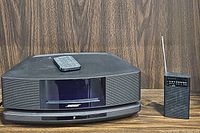 Overview of Bose Wave SoundTouch music system with remote and Sony portable FM/AM pocket radio