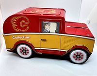 Side view of tin truck featuring Calgary Flames logo and graphics