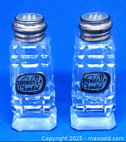 Front view of the pair of salt and pepper shakers showing the Bohemia Crystal labels and faceted crystal bodies