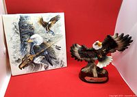 Louis Dionne eagle sculpture next to Judi Wild Indigenous-themed eagle wall tile, showing overall items in the lot.