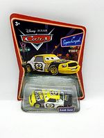 Front view of packaged diecast Leak Less character car from Disney Pixar Cars by Mattel, showing blister pack and cardboard backing with graphics and logos
