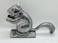 Front and side view of silver squirrel nutcracker showing the detailed face, paws, and tail.