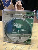 Photo of the two Blackspur 10-inch circular saw blades, one 32-tooth and one 60-tooth, in original packaging.