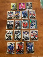 Overview of 18 hockey cards arranged on table, showing front images of players from the 2015/16 OPC Platinum collection.