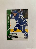 Front view of 2016 Upper Deck Parkhurst Series One Auston Matthews rookie card in high grade condition, showing player in Toronto Maple Leafs jersey number 34.