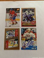 Four signed hockey cards featuring Montreal Canadiens players and Team Canada goalie Ken Dryden.