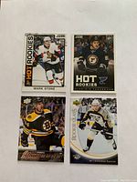 Four hockey rookie cards laid out showing players Mark Stone, Vladimir Tarasenko, Tyler Randell, and Aleksandr Radulov in their NHL uniforms.