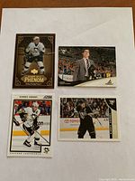 Four Sidney Crosby hockey cards displayed on white background: Diary of a Phenom, Pinnacle bench card, Score action card, and Supreme edition card.