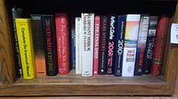 Shelf showing books including Reader's Digest Do-it-yourself Manual, Napoleons Lost Fleet, Holy Blood Holy Grail, and others