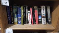 Shelf of assorted books showing titles and condition