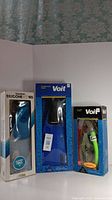 Overview of the three diving fins and snorkel in their original packaging, showing brands Dolfino and Voit and sizes