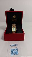 Giorgio Beverly Hills women's gold tone wristwatch displayed in original red box with black interior and logo.