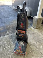 Full front and side view of the Bissell ProHeat Complete Pet Steam Cleaner showing the handle, controls, and base.