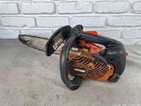 Full side profile showing the chainsaw blade, handle, and main body with Echo branding.