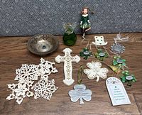 Overview of the Irish decor including bowl, cross, doilies, ornaments, bottle, and doll