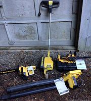 Full lot showing electric edger, cordless blower, McCulloch chainsaw and mini battery chainsaw.