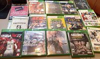 Top view of 15 Xbox game cases arranged to display titles and cover art.