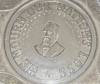 Close-up of the center of the plate showing embossed portrait of James Garfield and surrounding text.
