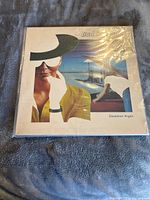 Front cover of Bad Company Desolation Angels vinyl LP, showing album artwork and shrink-wrap.