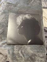 Barbra Streisand's Greatest Hits Volume 2 album cover showing a silhouette profile of Barbra Streisand against a dark background.