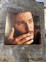 Front cover of the vinyl album featuring Bruce Springsteen's face close-up with the title.