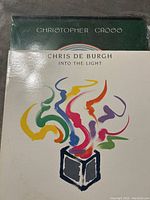Photo showing the front covers of two vinyl LP records: Chris De Burgh 'Into the Light' and Christopher Cross