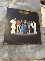 Front cover of Lynyrd Skynyrd Street Survivors album showing the band members.