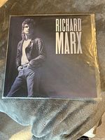 Front cover of the Richard Marx vinyl record album showing the artist in leather jacket and jeans.