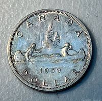 Reverse of coin showing CANADA DOLLAR 1959 Voyageur design