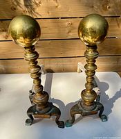 Front view showing both brass andirons