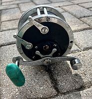 Front view showing model number 49, star drag, handle with green knob