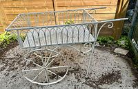 Overall view of metal garden cart showing design and condition