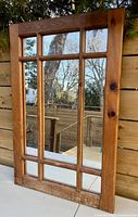 Front view of wood window-pane mirror showing six mirrored sections