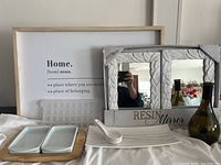 Framed wall art 'Home' text, mini ice cube tray, two resin mirrors, green wine bottle vase, serving platter and appetizer spoons shown together