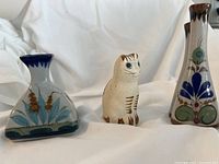 Three Mexican Tonalá pottery items: two vases and one cat figurine
