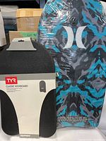 Photo showing the TYR Classic Kickboard in black with its packaging label, indicating it is new.