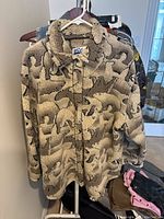 Front view of the fleece jacket showing polar bear pattern and collar.