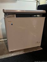 Front and side view of the closed white Danby chest freezer showing overall condition and size