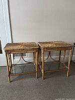 Pair of wicker side tables each with rectangular wicker top and removable under glass shelf, light brown/rattan color, bamboo style frames.