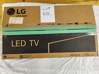 Photo of the LG 24LH4530 LED TV box showing branding, model number, and features.