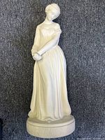Front view of full statue on grey carpet