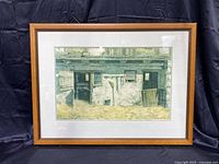 Full view of framed print with mat showing a rustic barn scene.